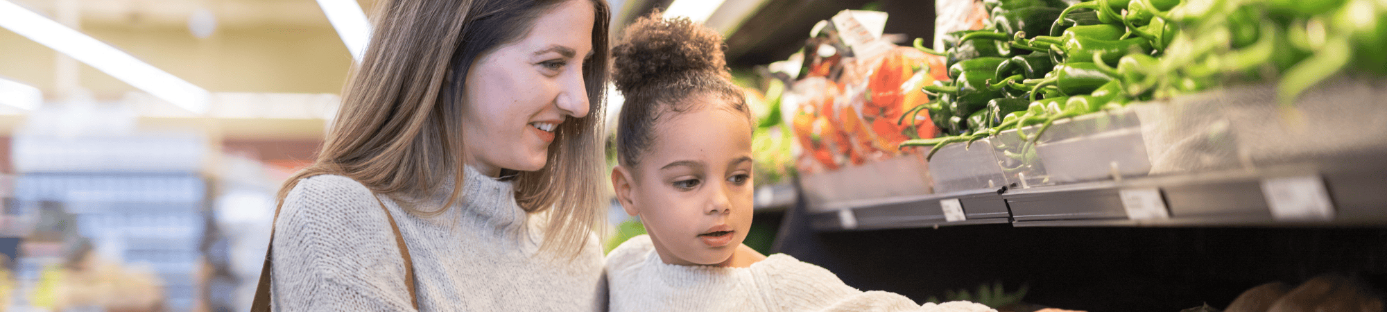 mom and child grocery shopping